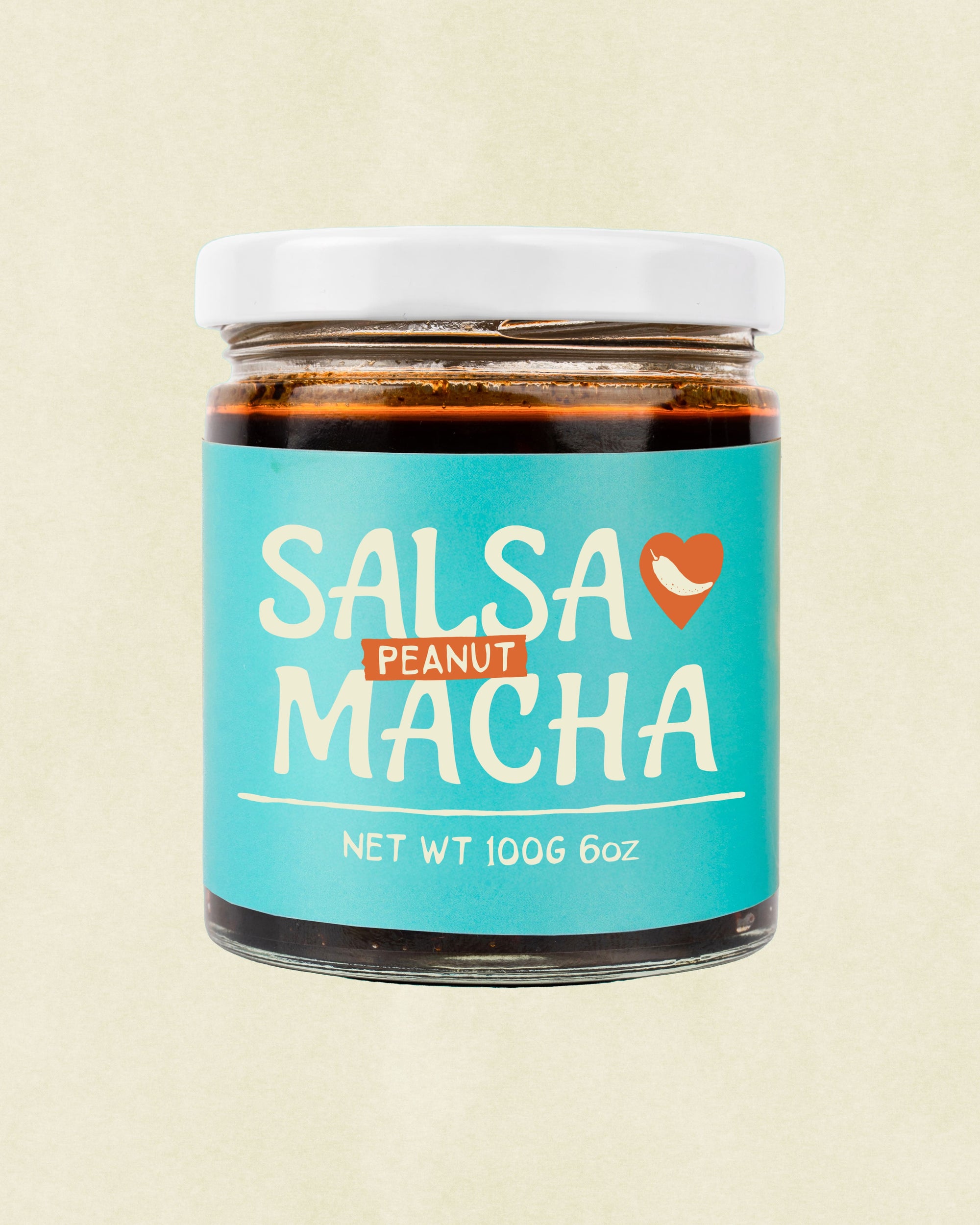 Front view of Veracruz All Natural Peanut Macha jar with label displayed on a beige background